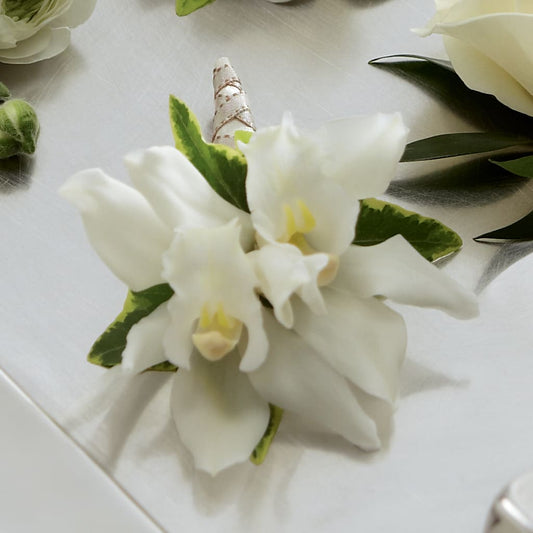 White Mini Cymbidium Boutonniere –  Diamond Flower Shop, Reading PA
